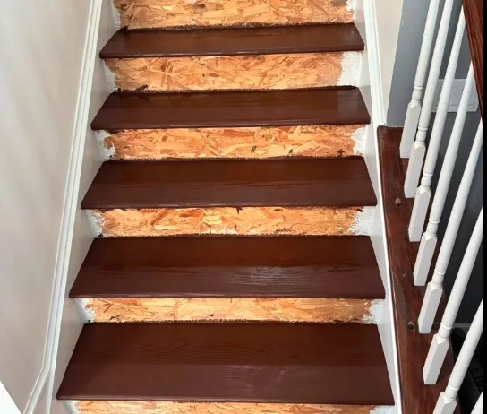 Freshly stained South Florida stair treads during a staircase restoration