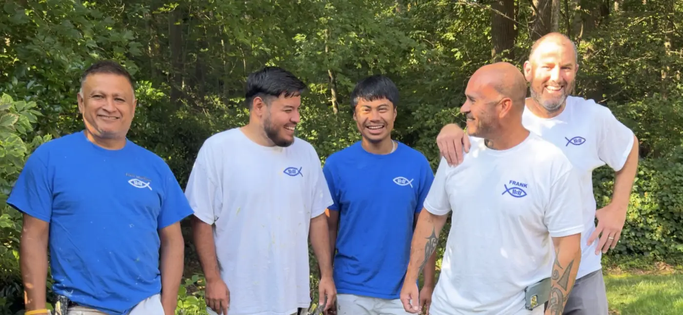Five members of the Prodigal Son Painting Maryland team on a job site